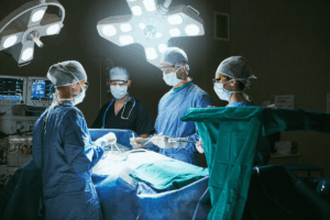 Surgeons and medical staff work together in an operating room, highlighting the teamwork and precision required in a medical science career. 